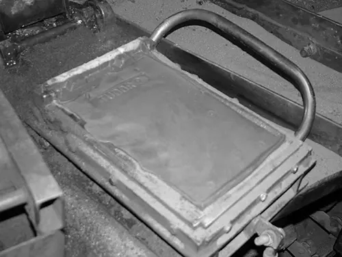Clay being pressed into a mould